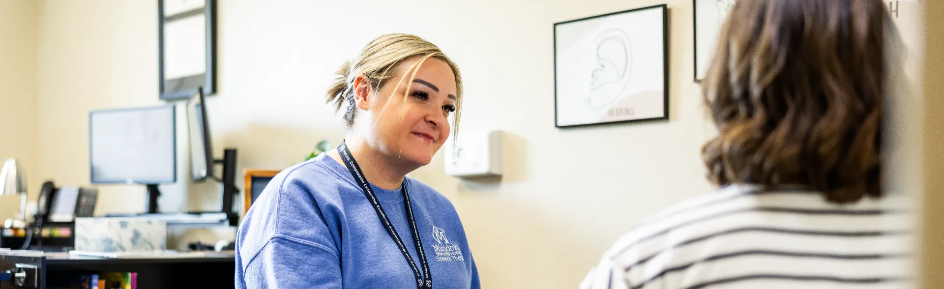 Speech Pathologist speaking to the mother of a child with communication problems.